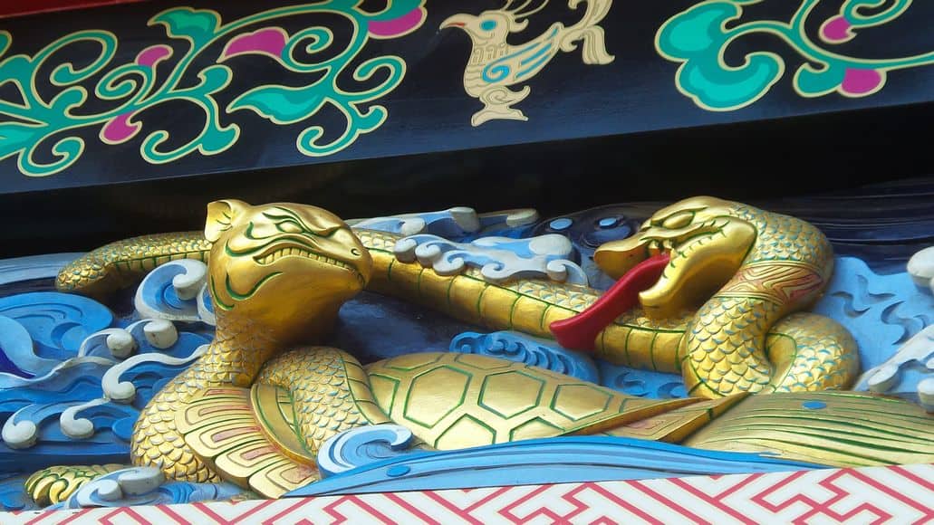 snake carving on historic japanese temple