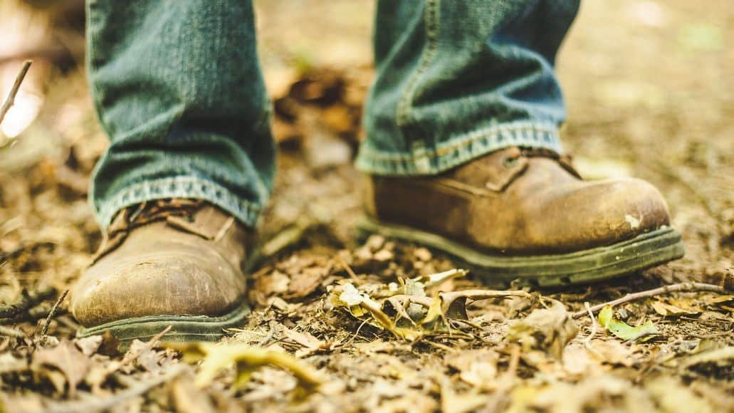 human feet in heavy boots