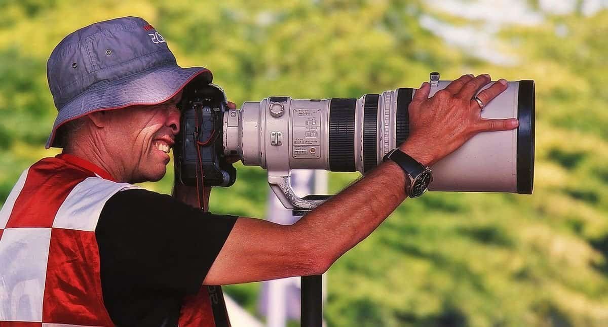 photographer using telephoto lens